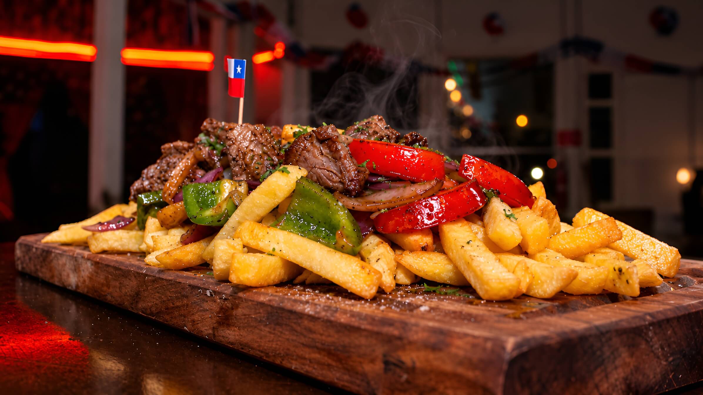 Tabla de carnes asadas con papas y pimentones servida en el restobar La Casona